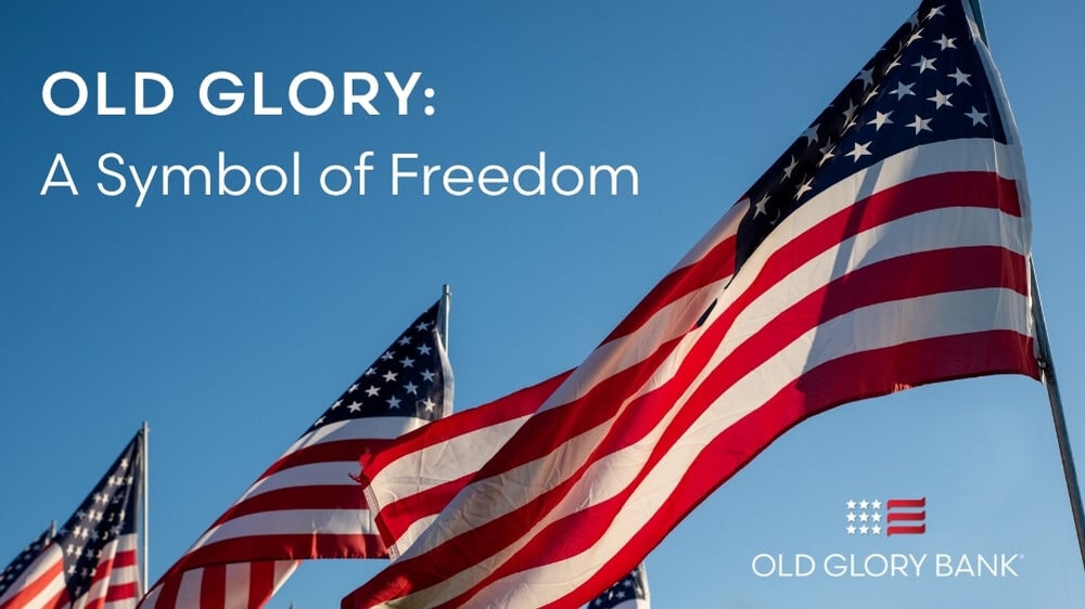 American flags waving in a blue sky